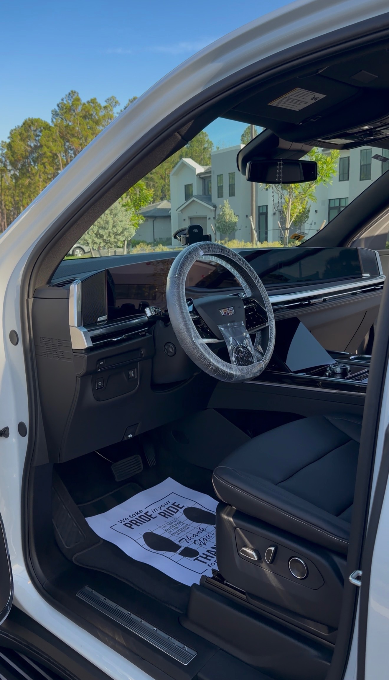 Cleaned luxury car interior with leather seats and dashboard.
